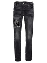 AMIRI straggered Logo Jeans - Men