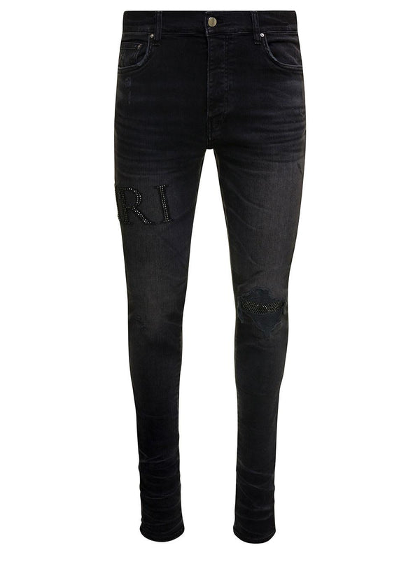 AMIRI Black Skinny Jeans With Crystal Embellished Logo And Used Effect In Stretch Cotton Denim Man - Men - Piano Luigi