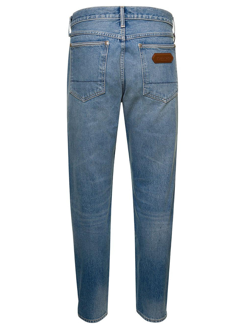 Tom Ford Light Blue 5-pocket Style Jeans With Rips And Logo Patch In Cotton Denim Man - Men - Piano Luigi